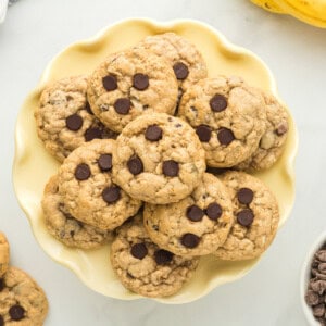 overhead image of banana breakfast cookies on a yellow plate