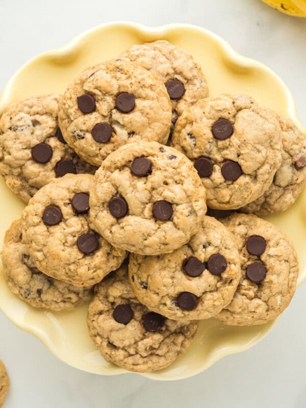 overhead image of banana breakfast cookies on a yellow plate