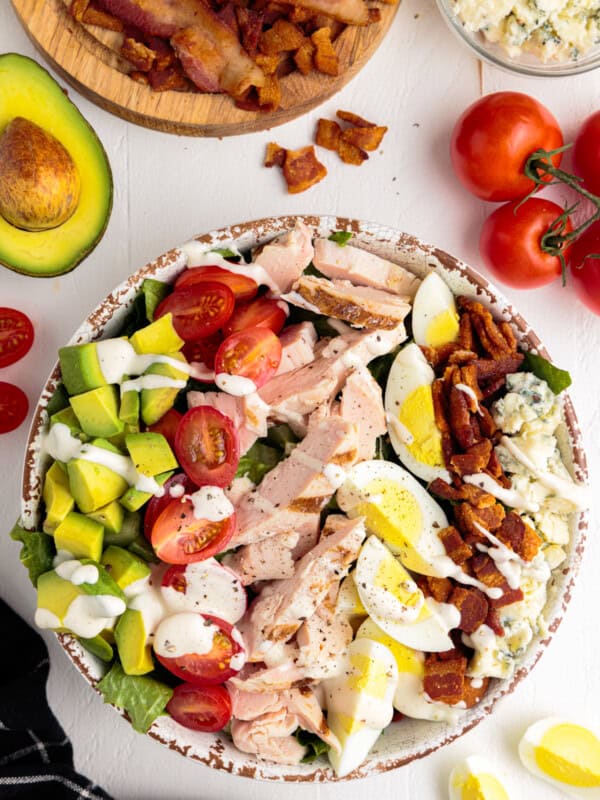 overhead image of cobb salad with dressing