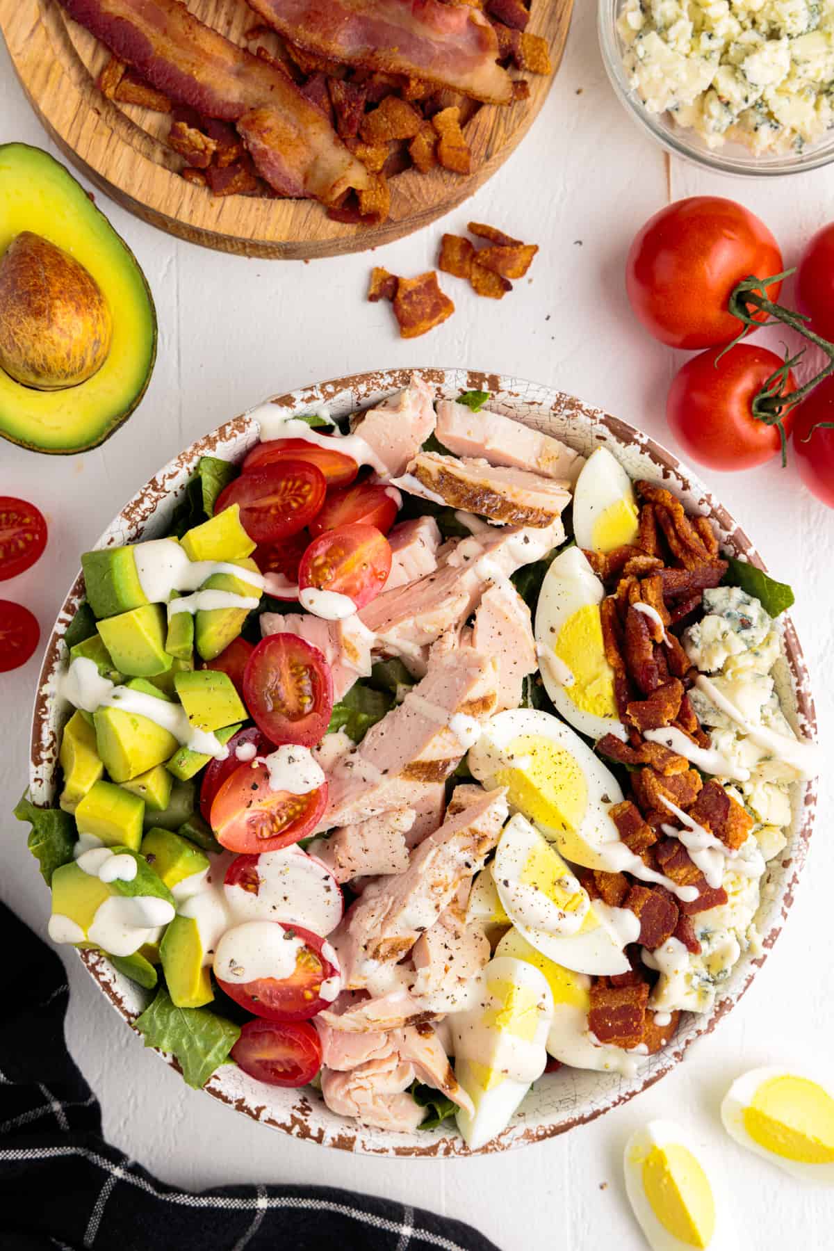 overhead image of cobb salad with dressing