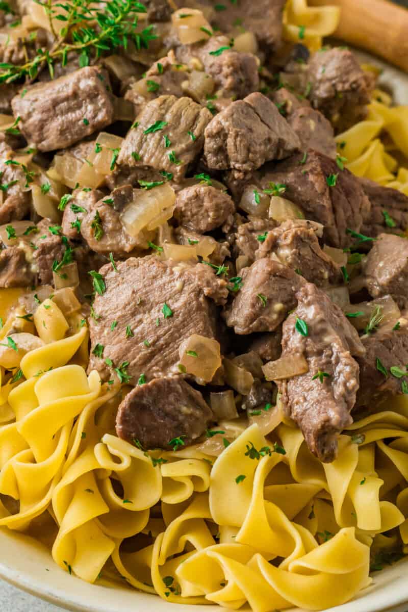 beef and noodles on a white serving platter