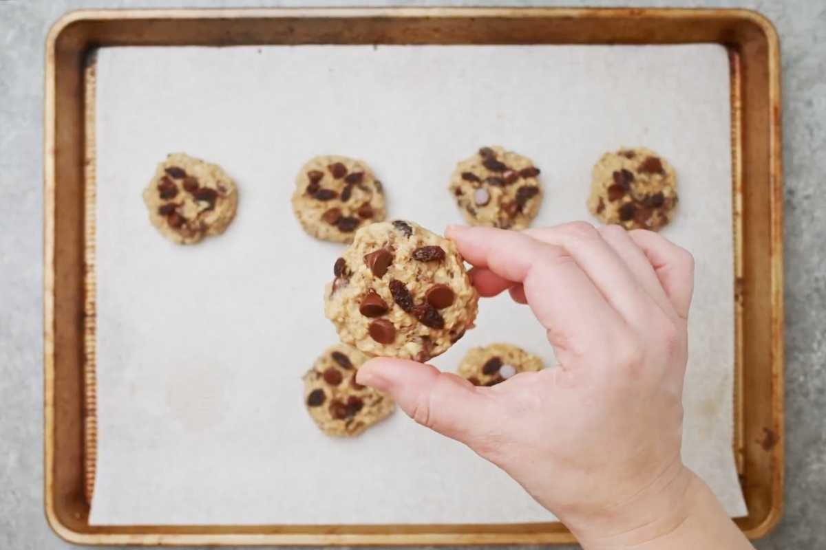 overhead click of baked cookies holding with the hand.