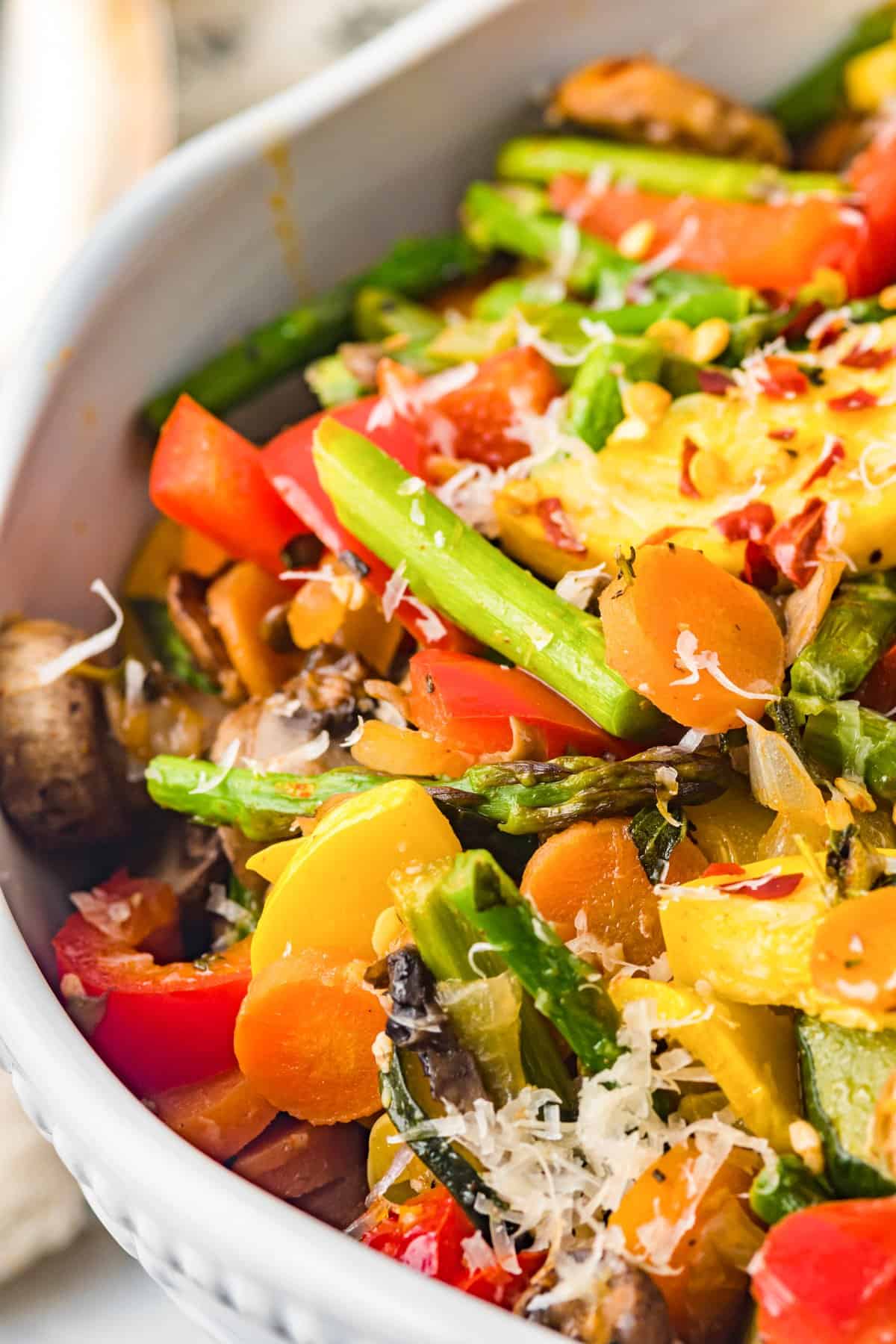 Close up on a bowl of mixed sautéed veggies.