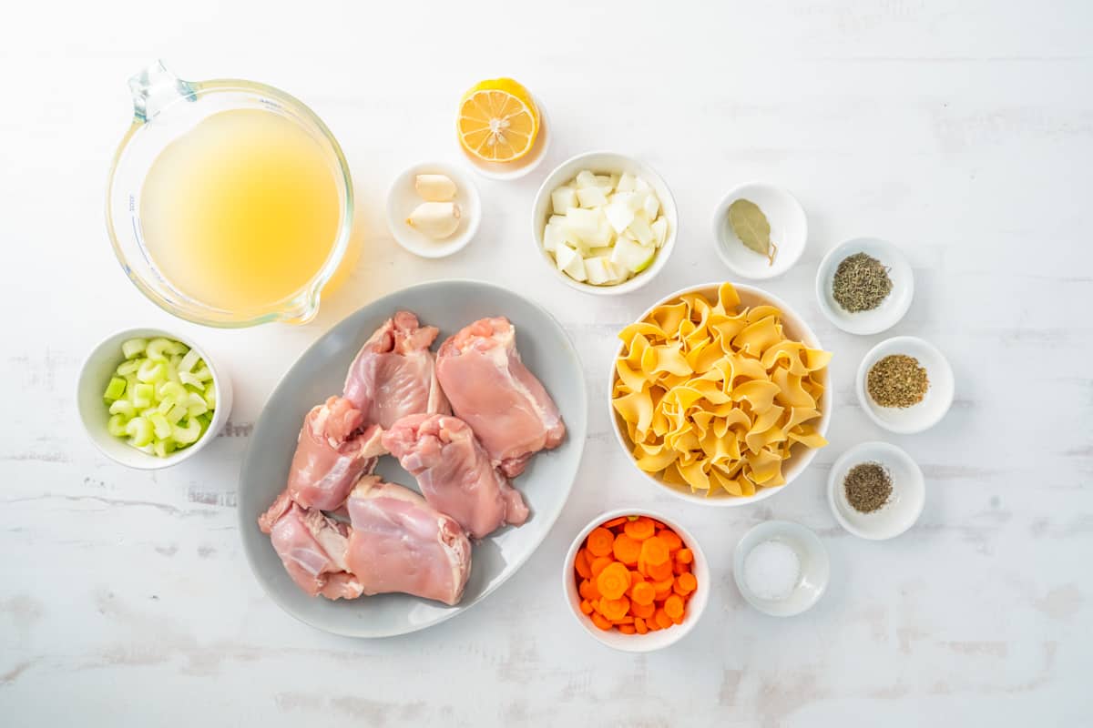 overhead view of ingredients for crockpot chicken noodle soup.