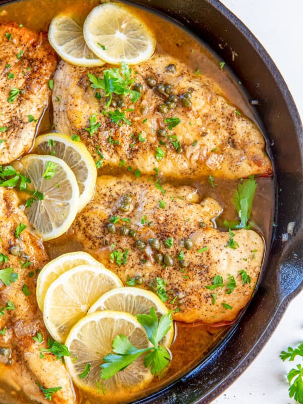 Close up of chicken piccata in a skillet.