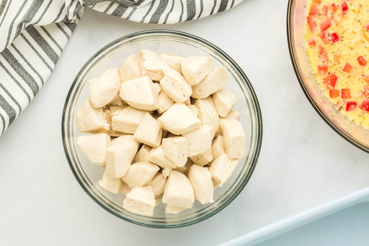 cut biscuit dough in a glass bowl.