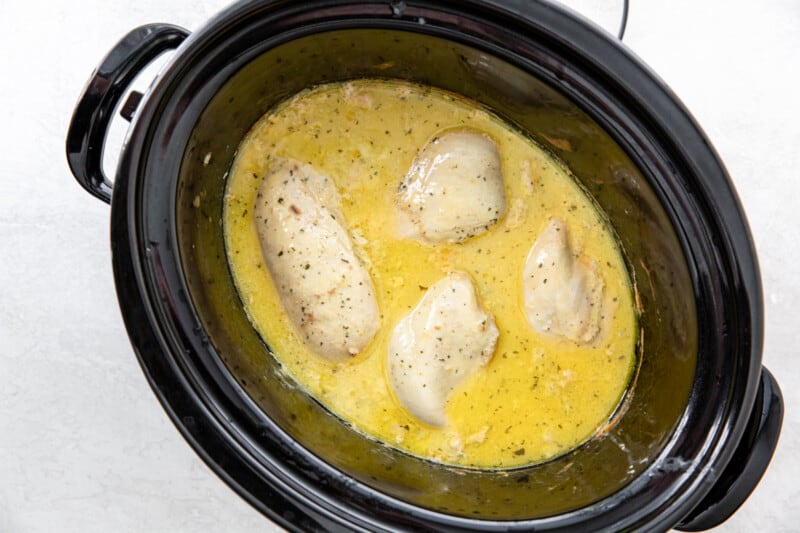 cooked crockpot ranch chicken in a crockpot.