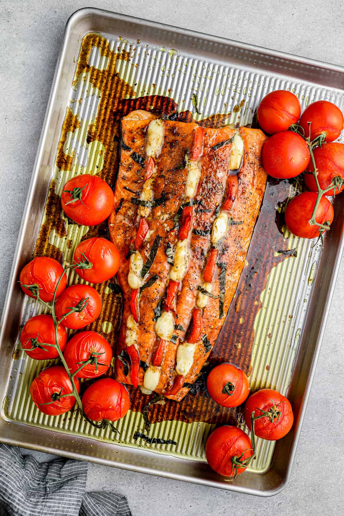 Baked salmon stuffed with mozzarella and tomatoes.