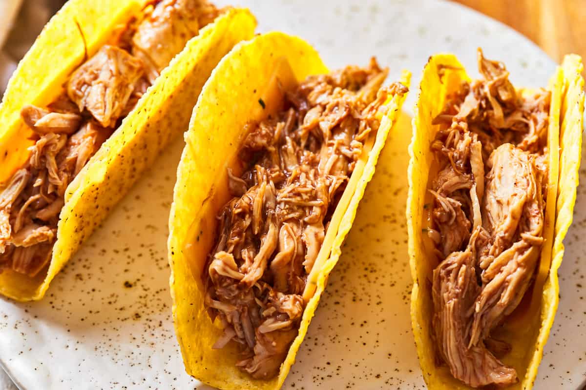 slow cooker pulled chicken in taco shells