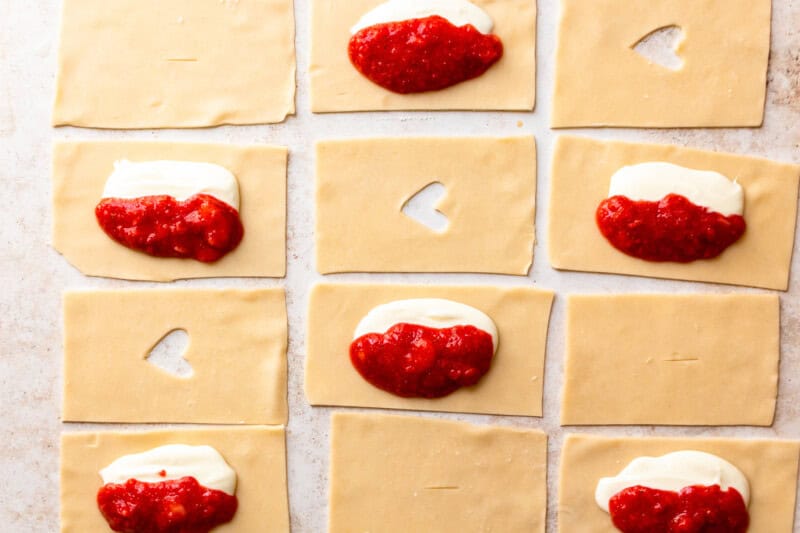 pie crust cut into 12 rectangles, some with strawberry cream cheese filling