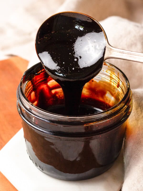 jar of balsamic glaze, spoon dipping into it