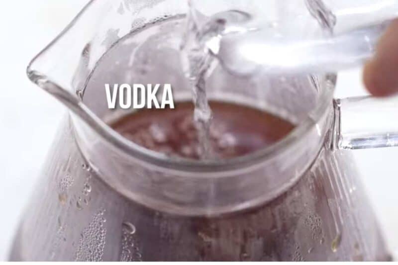 adding vodka in the raspberry sweet tea.