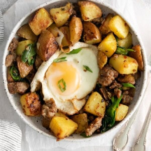 overhead view of breakfast hash in a white bowl.