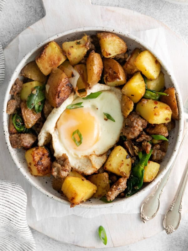 overhead view of breakfast hash in a white bowl.