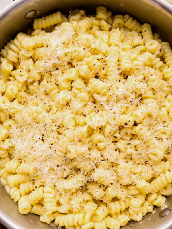 close up of cacio e pepe in a stainless steel pot.