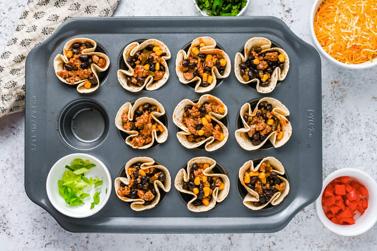 baked enchilada cups in a muffin tin.