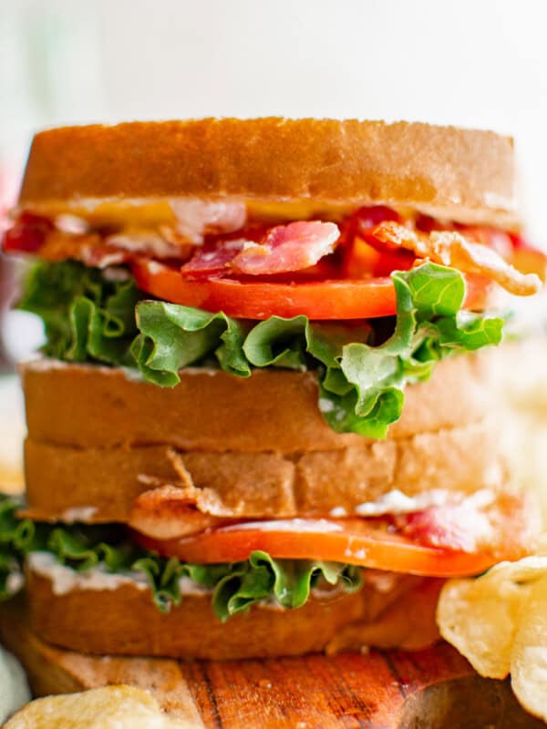 close up of 2 stacked blt sandwiches.