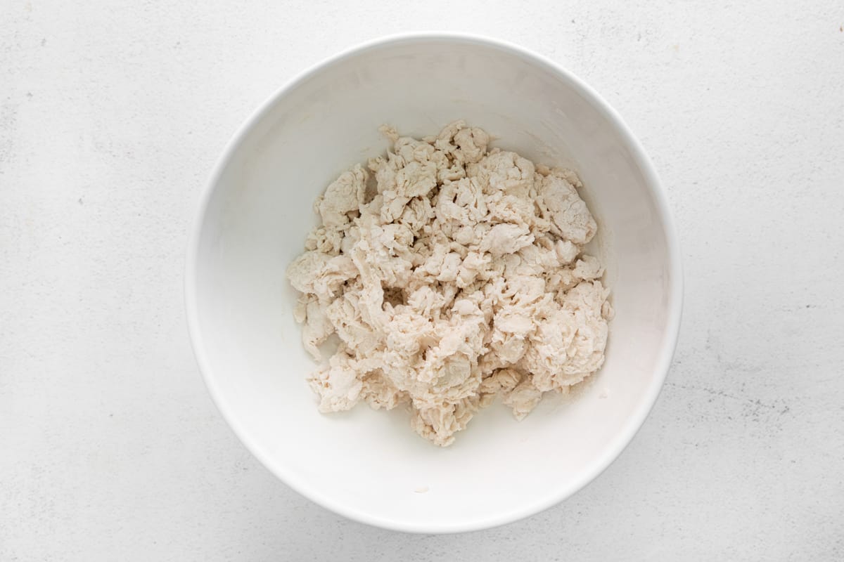 mixing dough in a bowl