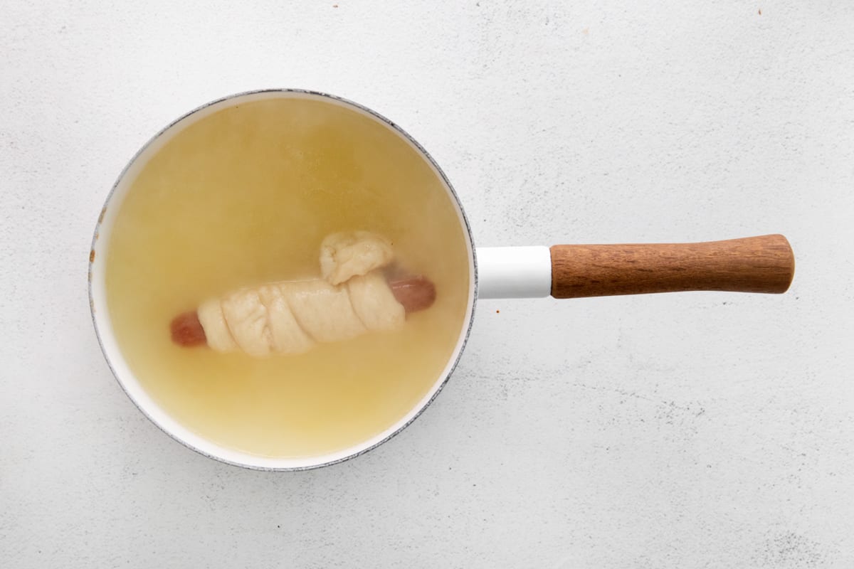 pretzel dog submerged in water