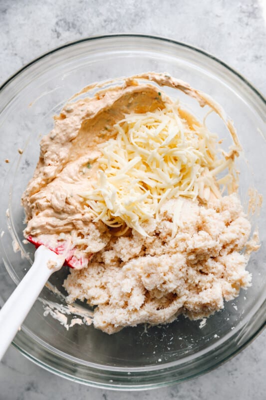 combining crab dip ingredients in a mixing bowl