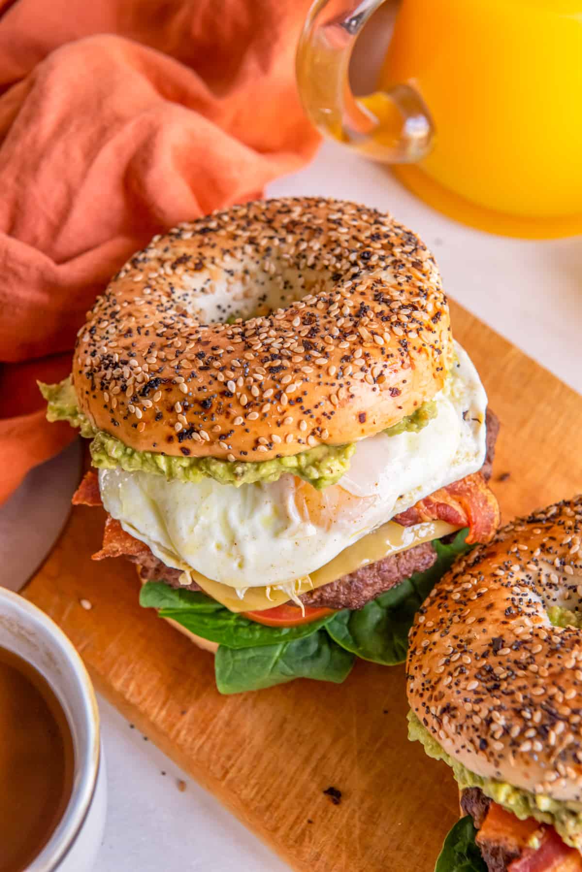 breakfast burgers on a wooden cutting board.