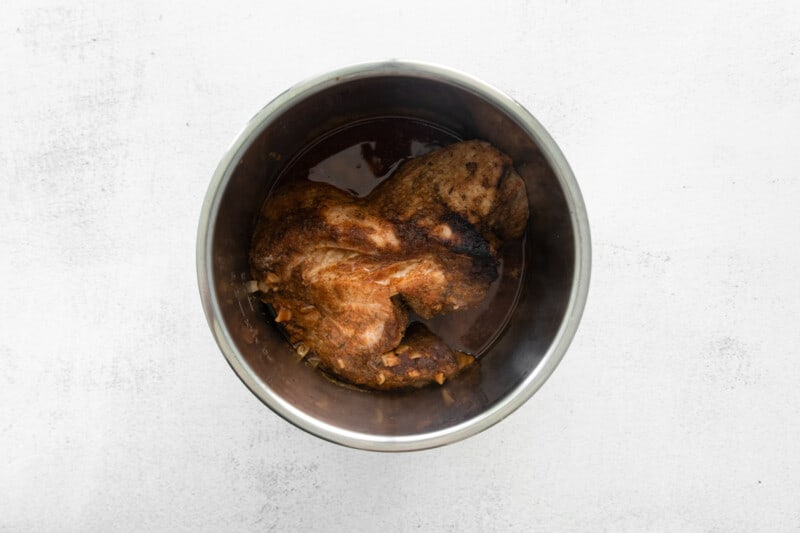 marinated pork in a mixing bowl