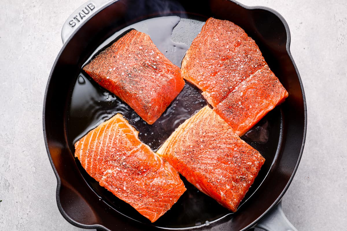 uncooked salmon in a skillet