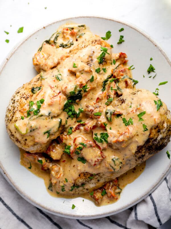 instant pot tuscan chicken on a white plate.