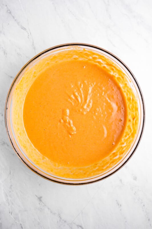 overhead view of sweet potato pie filling in a glass bowl.