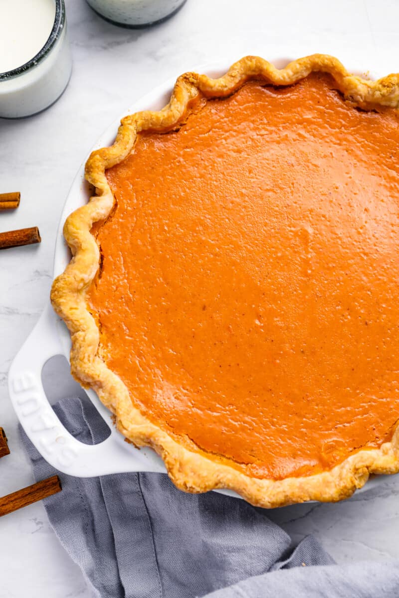 sweet potato pie in a white pie pan.