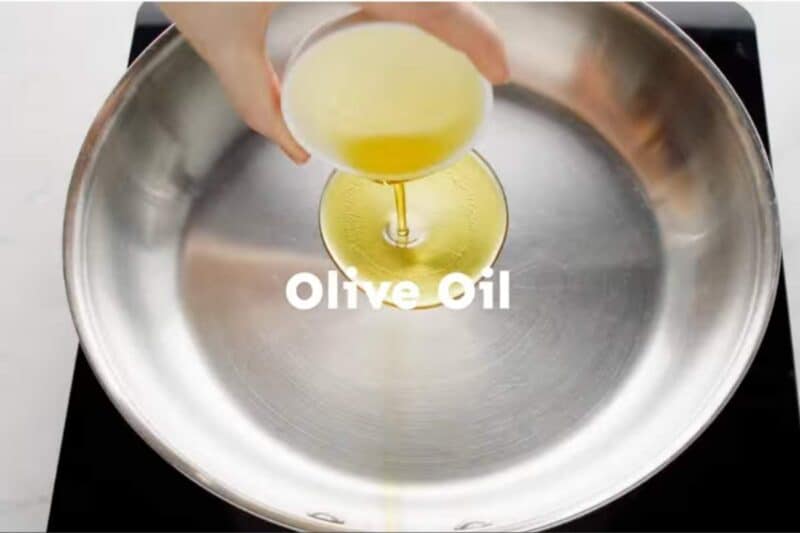 adding oil in a hot skilet