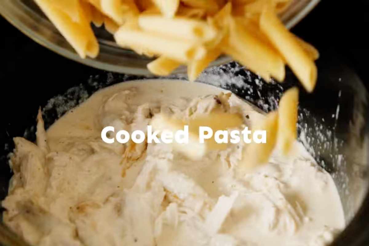 adding cooked and drained pasta in slow cooker