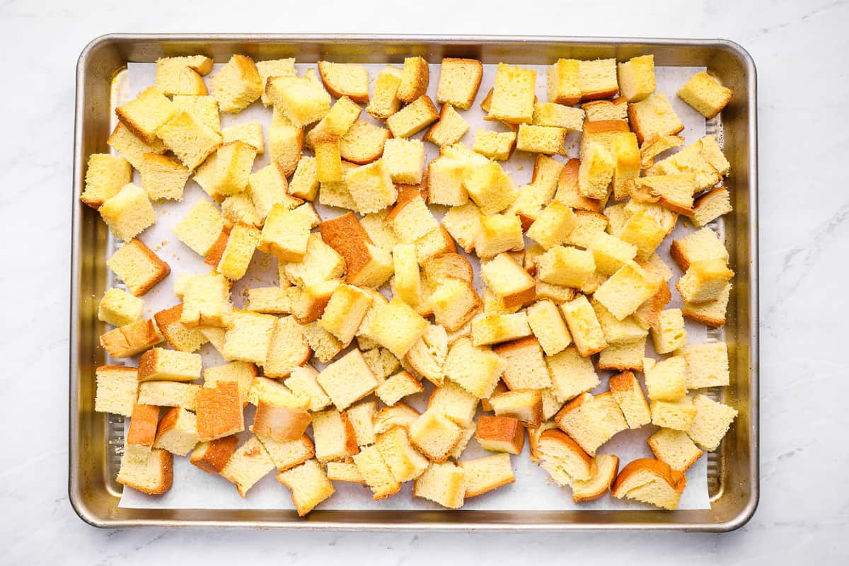 bread cubes on a baking sheet.