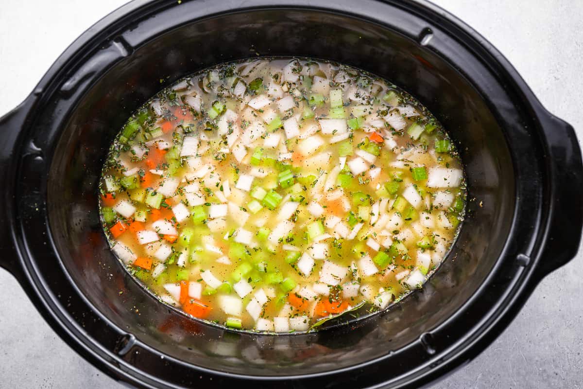 Soup ingredients in a slow cooker.