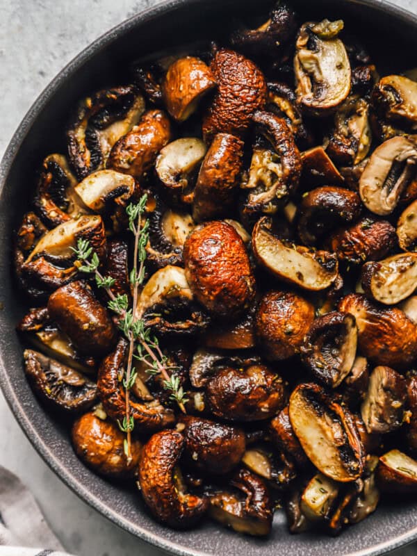 roasted mushrooms in a gray serving bowl.