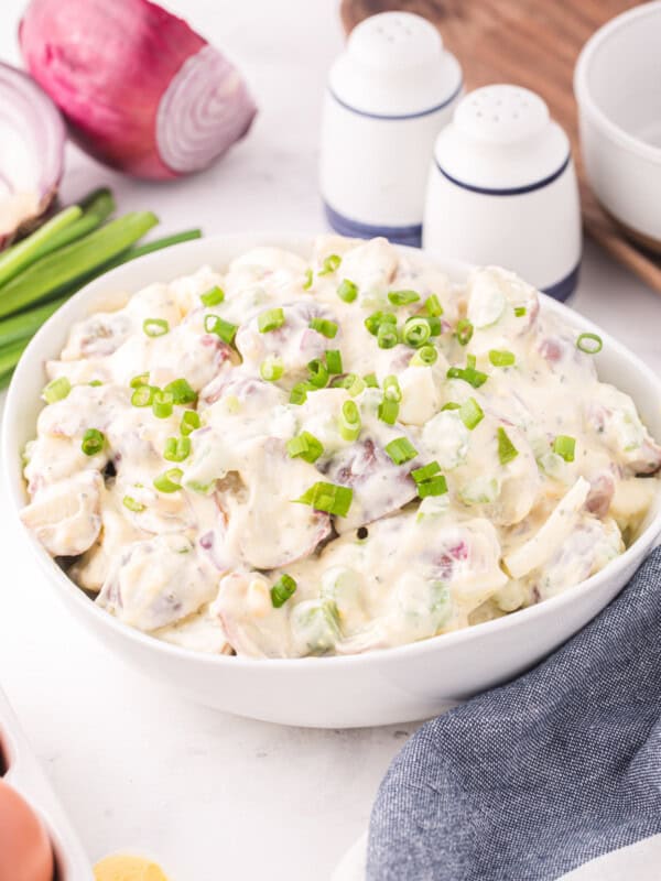 three-quarters view of ranch potato salad in a white bowl.