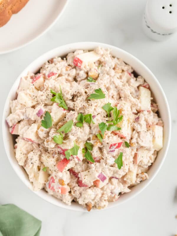 overhead view of tuna salad in a white bowl.