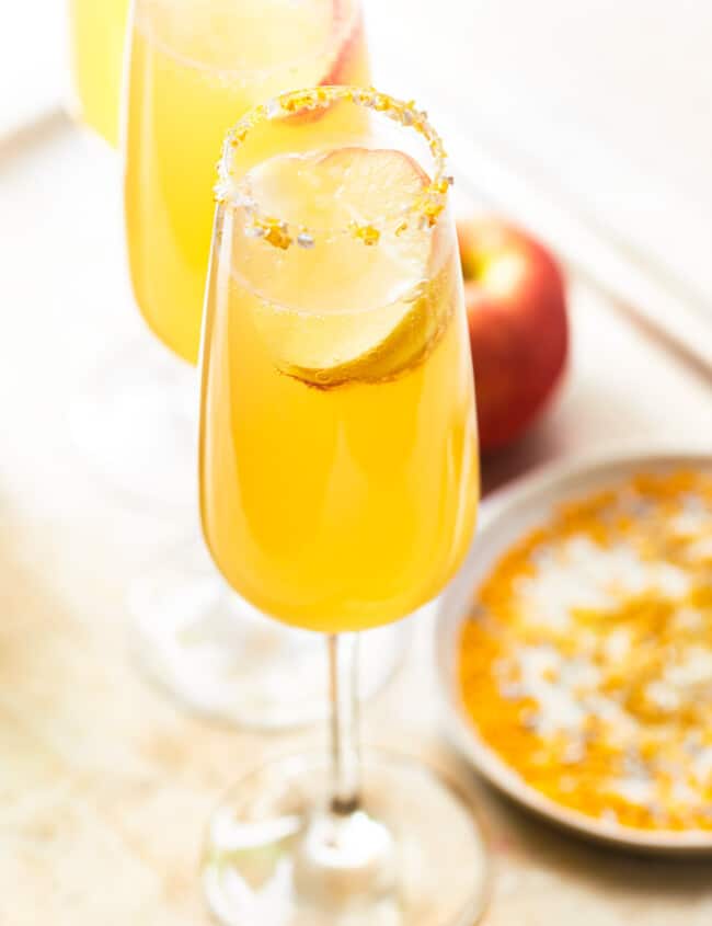 https://www.thecookierookie.com/wp-content/uploads/2023/04/featured-apple-cider-mimosas-recipe-650x845.jpg