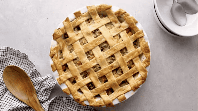 baked chicken pot pie casserole with a lattice pie crust.