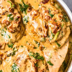 up close image of tuscan chicken in parmesan cream sauce