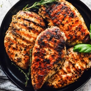 a plate of garlic herb grilled chicken breast