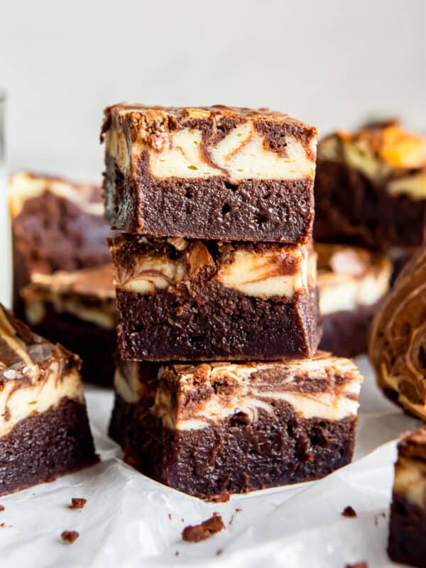 side view of 3 stacked cream cheese brownies.