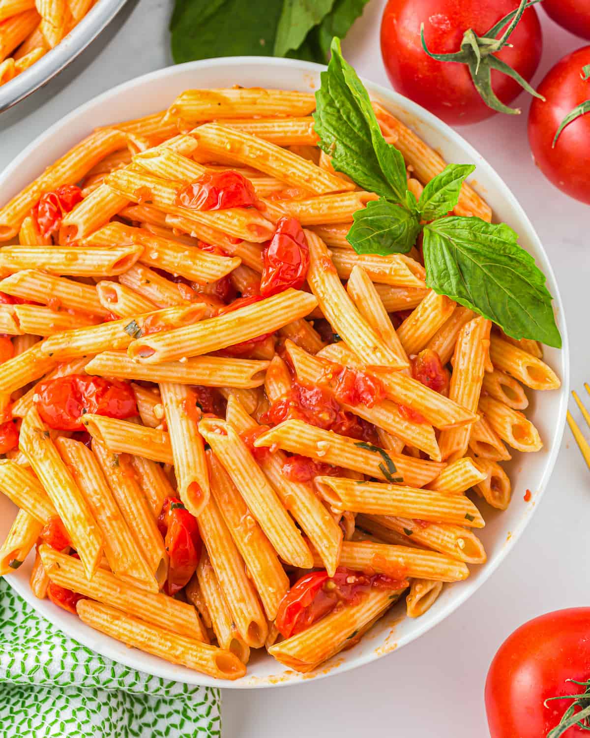 a bowl of pasta with cherry tomato pasta sauce.