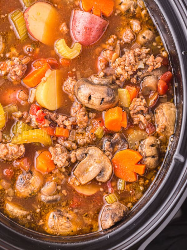 a crock pot full of meat and vegetables.