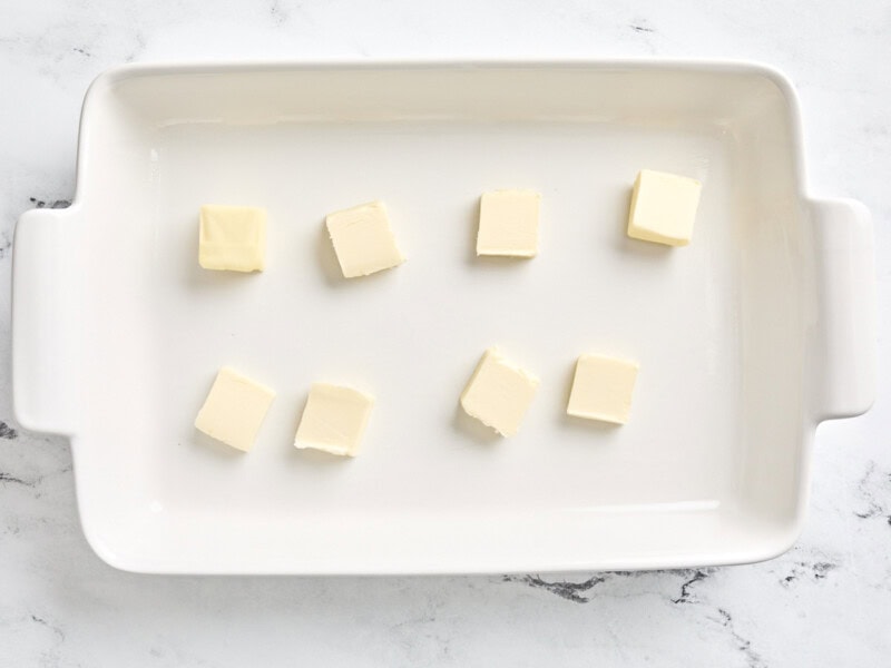 8 tablespoons of butter in a baking dish.