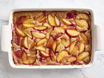 baked peach cobbler in a baking dish.