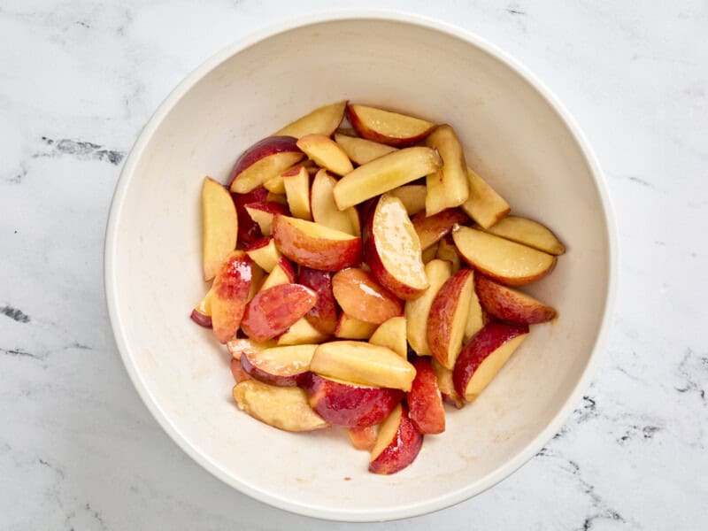 juicy sliced peaches in a bowl.