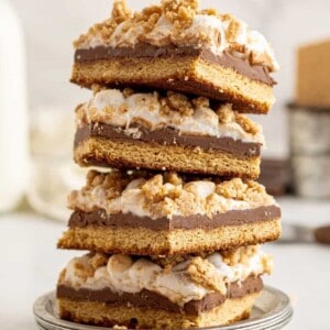 4 stacked smores bars on a small gray plate.