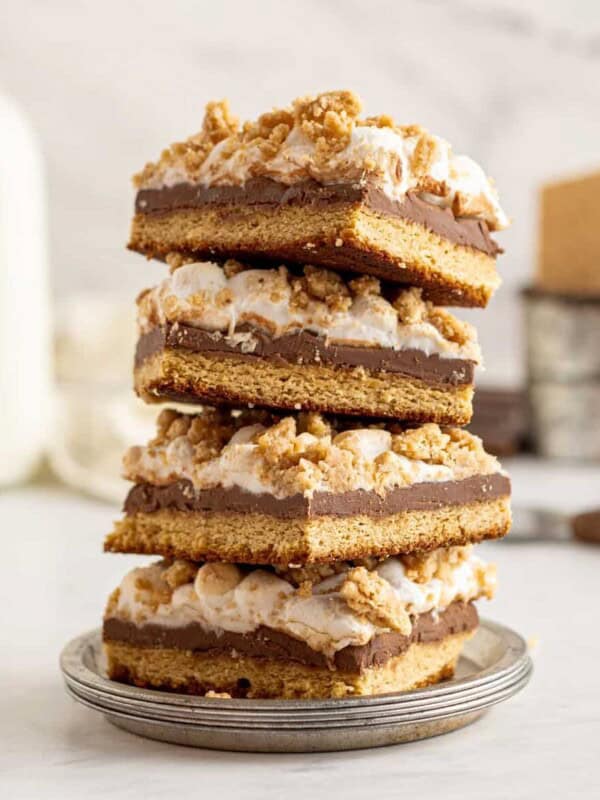 4 stacked smores bars on a small gray plate.