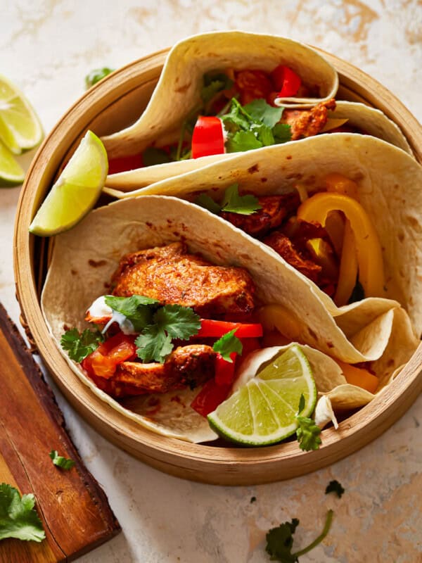 chicken tacos in a wooden bowl.